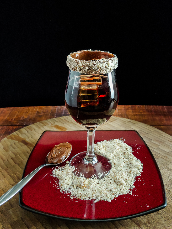 cocktail on red plate with spoon