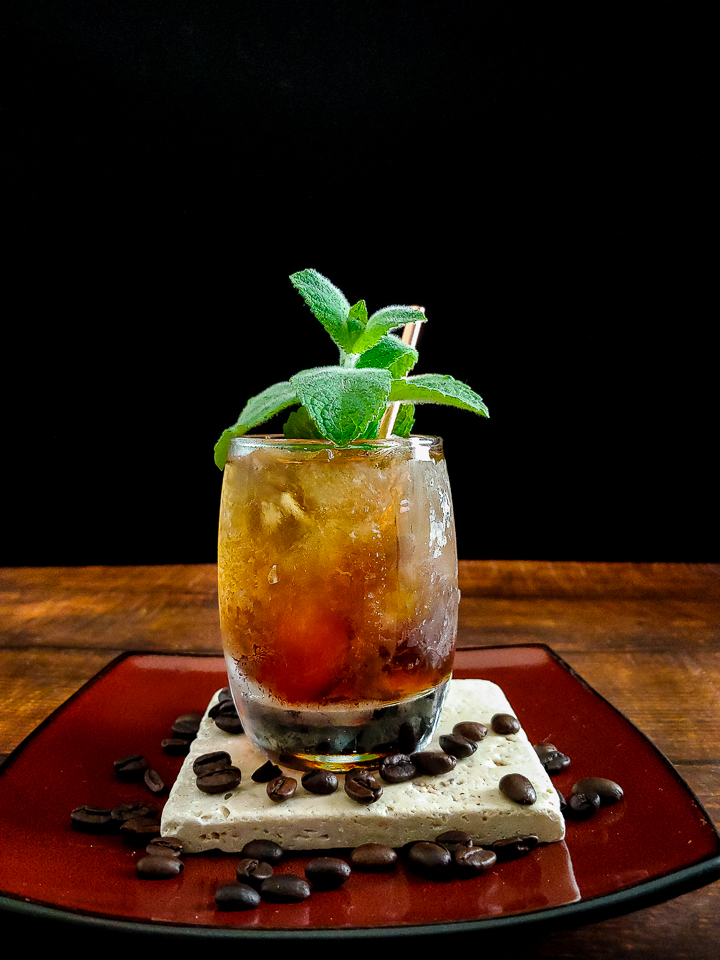 Julep cocktail with mint and coffee bean garnish
