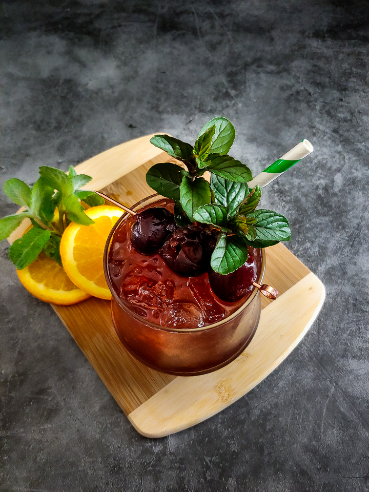 Cherry cocktail with cherry and mint garnish
