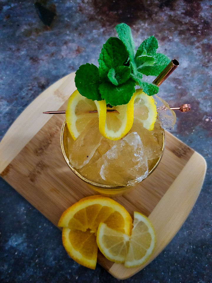 cocktail with mint and lemon garnish