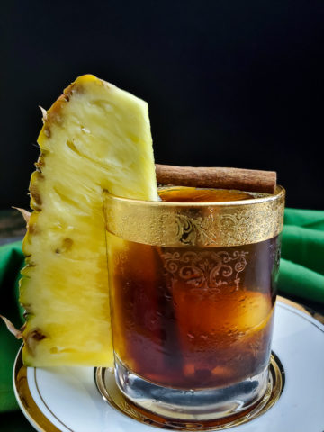 coffee cocktail with large pineapple garnish