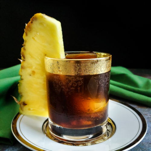 coffee cocktail with large pineapple garnish