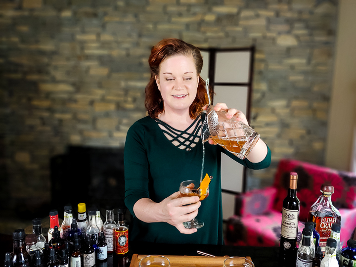 Picture of Heather Wibbels, Cocktail Contessa, pouring a cocktail