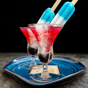 red bourbon margarita topped with a bomb pop