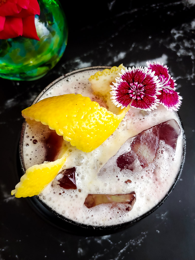 New York Sour - Whiskey sour with red wine float and lemon garnish