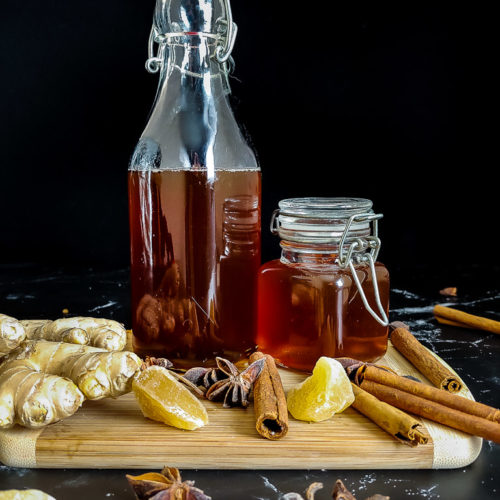 fall simple syrup in a jar surrounded by spices