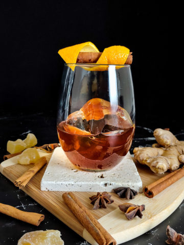 rum old fashioned on a cutting board with spices