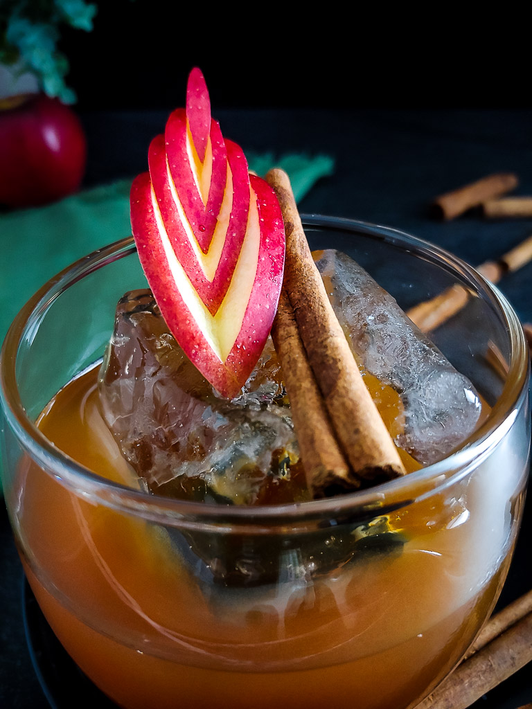 Apple Old Fashioned with apple and cinnamon stick garnish