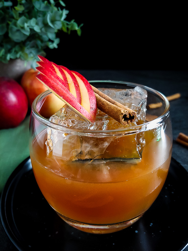 Apple Old Fashioned with apple and cinnamon stick garnish