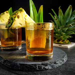 Rum tiki old fashioned with pineapple garnish