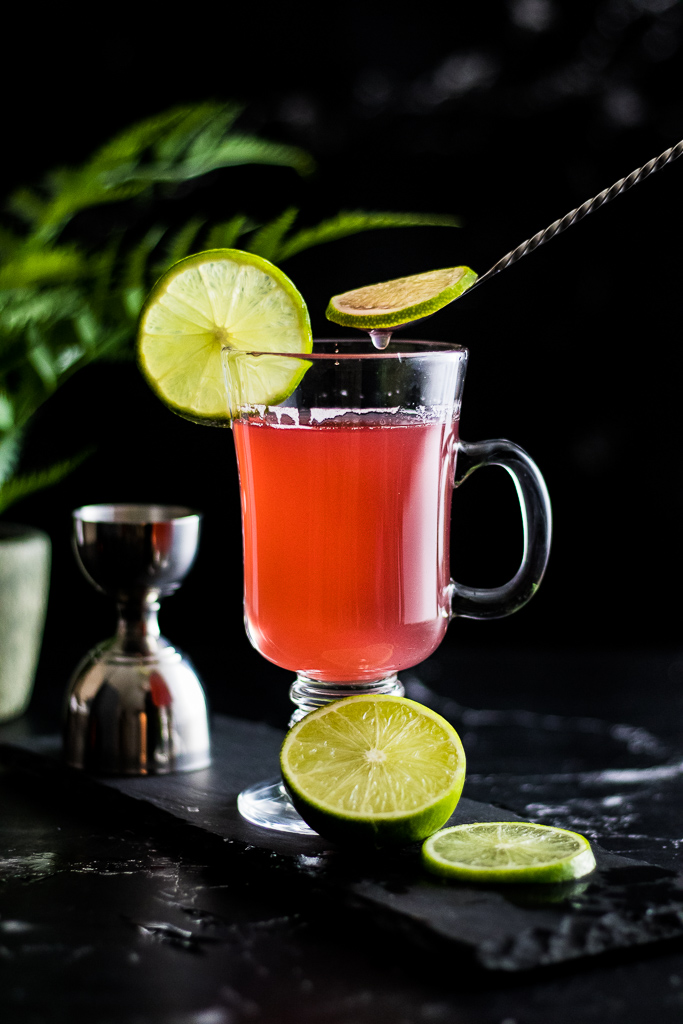 Gin Toddy - view of pink toddy with lime garnish