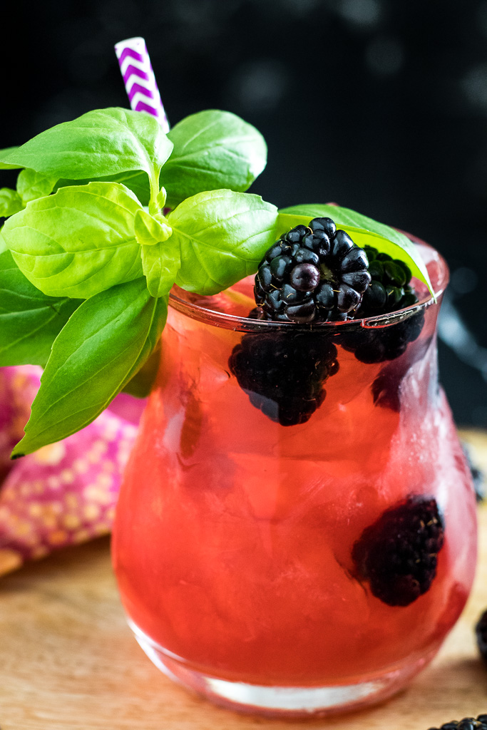 Blackberry Basil Julep - dark pink cocktail in a rocks glass with blackberry and basil garnish