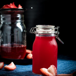 strawberry syrup for drinks in a glass mason jar