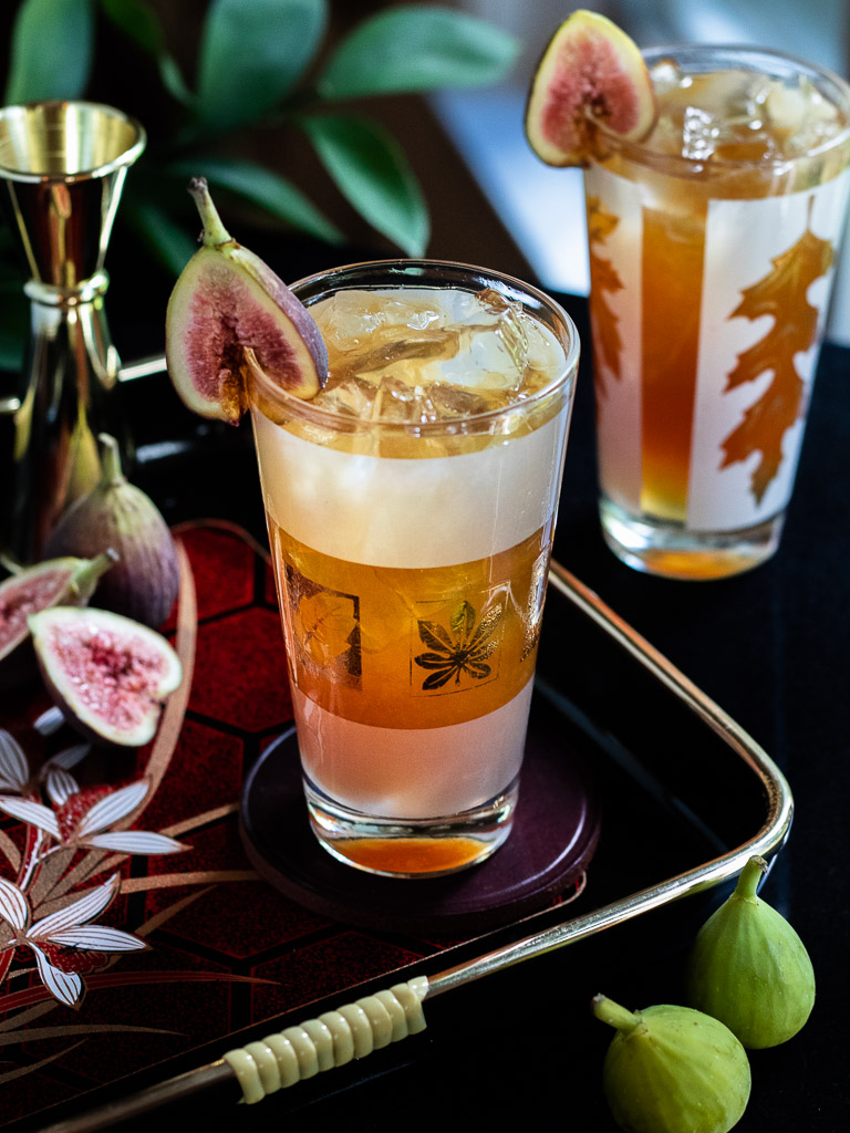 Fig Fall Amaro Highball - in a highball glass garnished with a fresh fig garnish