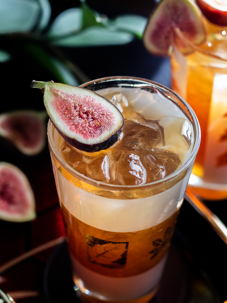Fig Fall Amaro Highball - in a highball glass garnished with a fresh fig garnish