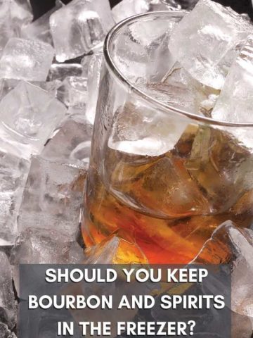 Should you keep bourbon and spirits in the freezer? overlaid on a whiskey glass in a pile of ice.