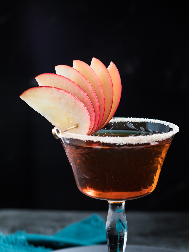 Apple Manhattan in a vintage coupe glass with apple fan garnish