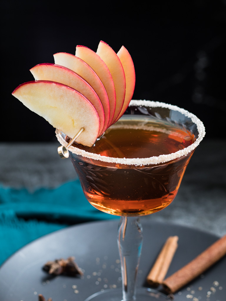 Apple Manhattan in a vintage coupe glass with apple fan garnish