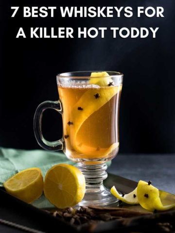 Title: 7 Best Whiskeys for a Hot Toddy with picture of toddy in clear mug