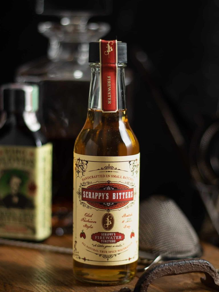 how to use spicy bitters - Scrappy's Firewater Bitters on a wooden tray