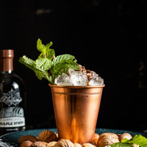 Pecan Nut Mint Julep in a copper julep cup garnished with mint and chopped nuts