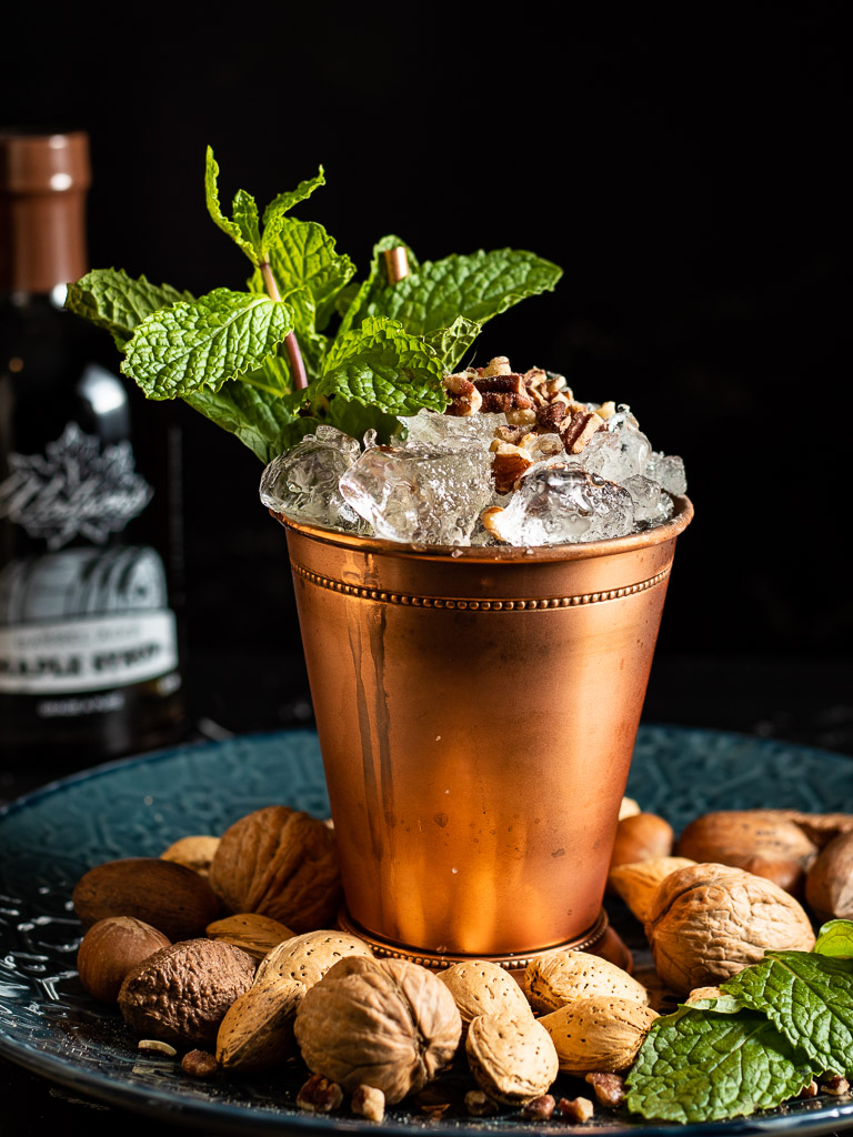 Pecan Nut Mint Julep in a copper julep cup garnished with mint and chopped nuts
