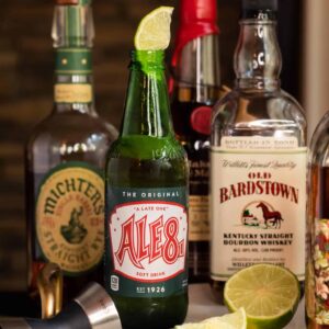 Bottle of Ale-8 One with a lime in it and bourbon bottles - Kentucky Ranch Water