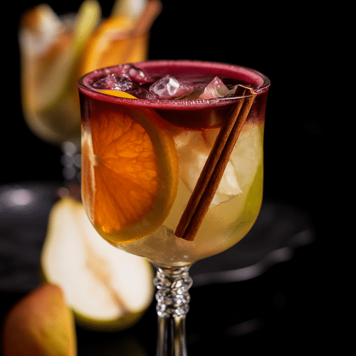 white wine sangria with ice, citrus and cinnamon sticks. topped with red wine float